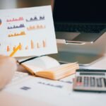 Analyst reviewing charts and financial data to apply discounts for lack of marketability and control