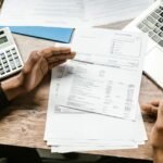 Financial documents and laptop used to allocate purchase price in an asset sale vs stock sale