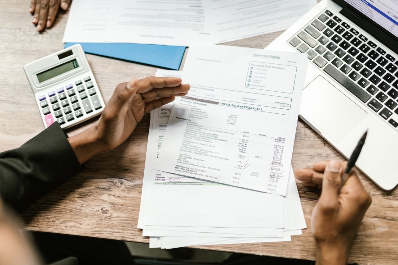 Financial documents and laptop used to allocate purchase price in an asset sale vs stock sale